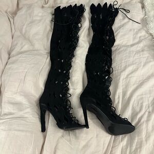 Thigh high black sandals